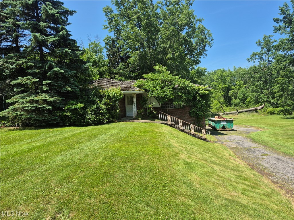 This 3 bedroom, 2 bath home offers a fantastic opportunity to create your dream space. Located on a spacious, 2 parcel lot, with mature trees and totaling over 3 acres. While the home requires some TLC and updates, it offers a bright, airy layout and lower level gas fireplace. This property is a renovators dream. Don't miss the opportunity to customized your own home!