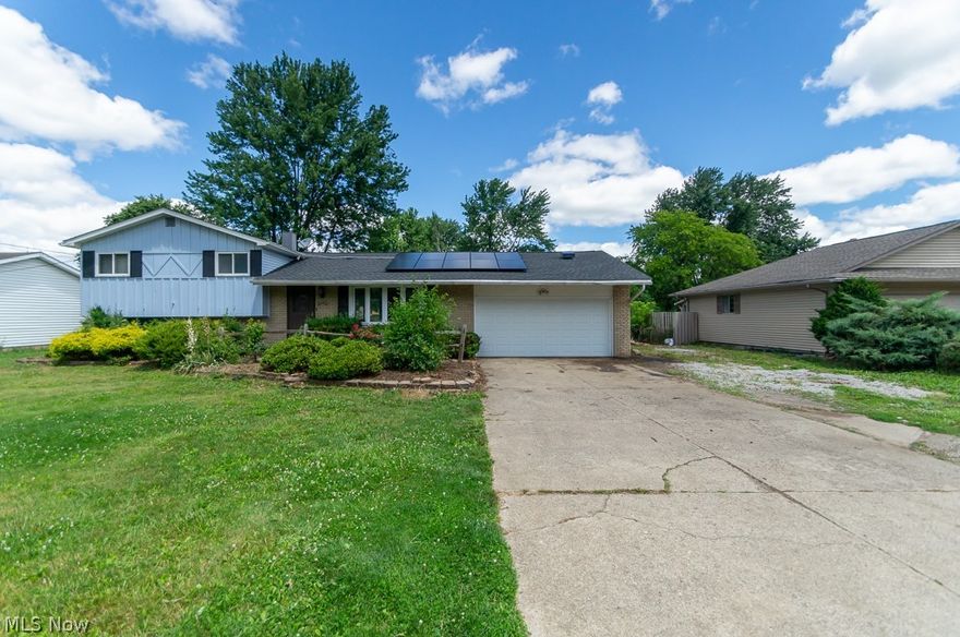 Large Home, Large Yard, Spectacular Location & New Solar Panels (Approx. $30K Invested) For Energy $$$ Savings...Spacious 4 bdrm 1-1/2 bath Split Level including newer vinyl windows, newly painted interior, an updated eat in kitchen w/ premium cherry cabinets, Corian countertops, stone backsplash, a built-in breakfast bar, & updated appliances. Beautiful wood trim accents are seen throughout the home for that added touch. The bay window allows for a light filled large living room that's open to the dining room with a slider door that leads out to an extra wide patio that's surrounded by a larger than normal .52 acre lot that's full of green space, edged with trees and shrubs for added privacy, along with a fully enclosed chain link fence.  The lower level family room, 4th bedroom (Great Den/Office) & half bath offers separate living space for added convenience & privacy. All 3 bedrooms upstairs have ceiling fans. The basement has had waterproof wall panels installed, and has a newer fu