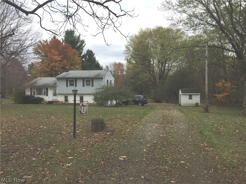 3 bedroom 1.5 bath split level home with 2 car attached garage. EXTRA 3.28 Acre lot included with sale.