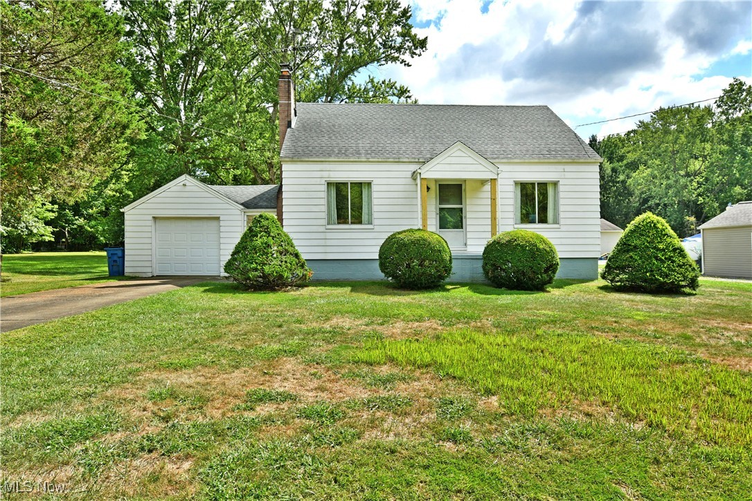 Impressively spacious and perfectly cozy, this darling Vienne residence has a lot to offer! Nestled within a quiet side street, this home features a large property that outstretches to the far tree line; allowing plenty of room for growth, secondary structures or simply enjoy the scenic, natural views. The charming curb appeal denotes manicured landscaping and a covered front entryway that stands out along the clean exterior. A single car garage is attached to the residence, creating a secondary covered side entrance. Through the front door, a welcoming living room showcases its warm, hardwood flooring as sunshine spills across the stone lined fireplace and handsome wood mantle. Around the corner the colorful kitchen and included eat-in dining space delights with its wrapping tile work and tall cabinets. Down the main hall, the inviting full bath highlights a naturally lit tub to soak away the day’s stresses. Two spacious bedrooms each continue with hardwood flooring and multiple windows to give that soft, embracing feel of comfort; all remarkably kept in condition. Upstairs, the insulated loft is easily finished or used as-is for storage. The full basement includes both laundry and utility services. Upstairs has a spacious attic with so many options. Make sure you see it up the steps. Move-in ready with major updates completed! This home features a newer roof (2019) and with a brand-new central air conditioning unit, furnace, and hot water system (2025). A brand new septic system will be installed in the next two weeks. The seller has also contracted for brand-new windows to be installed in September 2025. For added convenience, the seller is offering a flooring allowance at an acceptable offer price, and will be installing an upstairs shower head. This is a fantastic opportunity to own a home with peace of mind and room to personalize!