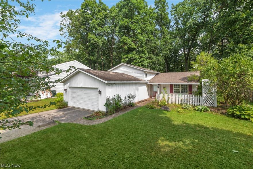 This well located Olmsted Falls split level home just needs a little TLC in order to become your dream home.  The Eat-In kitchen features hard wood floors and granite countertops.  The family room has a custom made built in and a wood burning fireplace.  Step out of the large slider onto the stamped concrete patio which leads out to a large back yard and access to a creek.  Plenty of storage and closet space.  Westview HOA has a heated pool, swim team, tennis courts, and  basket ball courts.  Don't miss this opportunity to own this well located Olmsted Falls gem.