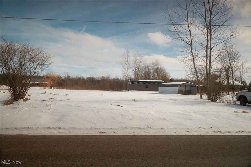 Your opportunity for 5.3 Acres across the street from a 103-acre park (Sprinkle's Serenity Park), a fishing park (Hurdle Waterfowl Park) with a 4.5-acre fishing pond within walking distance, a horse path behind the property and riding park within 5 miles. Newer shed approximately 12' x 30'.  Well on property.  Rural water in street.  Pasture to the rear of the property, planted with grass and a run-in-shed.   12' x 12' Barn, 3-side front for raising calves.