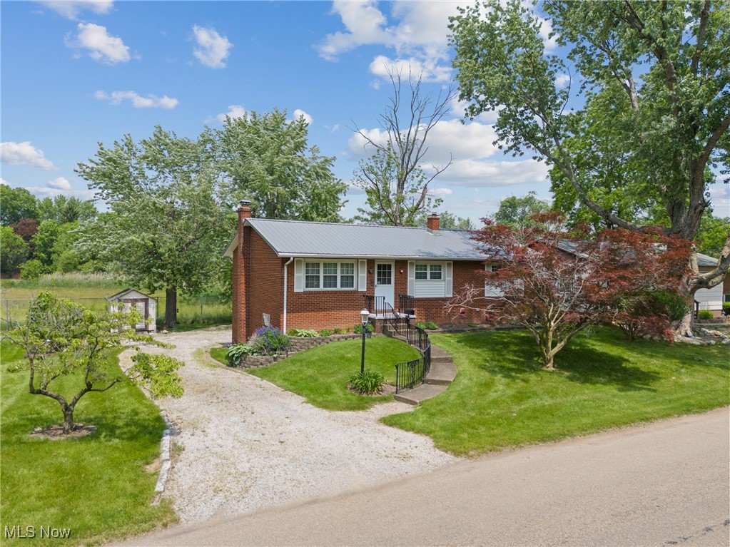 Welcome to this charming 3-bedroom, 1-bath brick ranch situated in the Plain Local School District. This home features a durable metal roof, an attached 1-car garage, and a full basement—perfect for extra storage, a workshop, or future finishing. Step inside to discover a functional layout with cozy living spaces, an eat-in kitchen, and large windows that invite natural light. Sitting on two parcels, the property includes an extra lot and a backyard storage barn, offering additional outdoor space and flexibility. Conveniently located near shopping, dining, and major roadways, this home blends classic charm with endless potential. Property is being sold as-is.