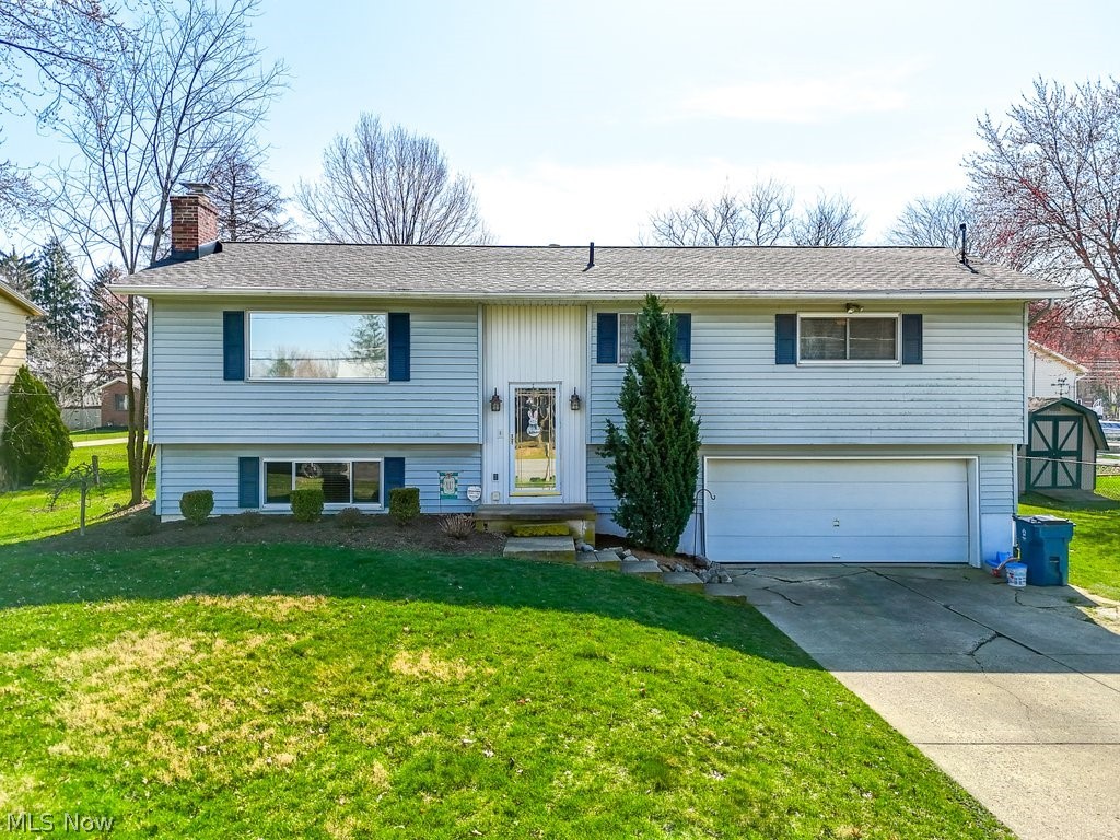 Welcome to 439 Colonial Ave. home located in beautiful Canal Fulton! This rare 4 bedroom, 2.5 bath home that has been recently updated and meticulously maintained over the years and is now ready for a new owner. Situated on a third acre lot, with a big backyard. The location could NOT be better. First, you come into the foyer with high ceilings which leads you up to the first floor. You come to the spacious living room that lets in a lot of natural light. Then you make your way into the spacious eat-in kitchen that features granite countertops, brand new laminate wood flooring, tile backsplash, all stainless-steel appliances and access to the large deck off the kitchen which overlooks the outdoor living area that features an outdoor fireplace. (Deck re-built in 2021). All the bathrooms have been updated (2022). Generously sized bedrooms that feature laminate wood flooring throughout. Master bedroom features a half bath that has been updated (2022). Continuing downstairs that features a cozy family room with a wood burning fireplace. Generous sized laundry area is located off the downstairs family room that has lots of storage space as well. This home also features a brand-new roof (August 2021 - 10-year transferable warranty included for new owner). The A/C unit was replaced in 2017. The heated 2 car garage is spacious and deep for storage. We recognize the condition of the driveway that could use some updating which has been considered in the price of this home. This property truly has it ALL! Do not wait! Schedule your showing today!