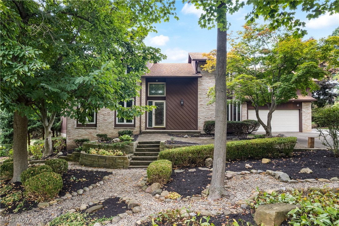 NOW!...Look at This! 6 BR, 3 full/2 half bath Contemporary Style Home offering unique style and living right in your backyard. Relax and entertain with an in-ground pool, screened porch, spacious deck, patio, and breathtaking landscaping complete with tranquil water feature pond and waterfall. Inside, this home offers multiple living spaces to fit every need. The first floor features formal living and dining rooms, a vast great room with a double sided fireplace that leads you into the Scotch Room with wet bar, built in seating, shelving and cabinetry, bright vaulted sunroom with spiral staircase leading to the finished lower level where you will find a rec room w/ kitchenette, half bath, office and storage opportunities everywhere.. The large eat-in kitchen offers a walk-in pantry, upscale stainless steel appliances, a Sub-Zero refrigerator, full-size stainless freezer, newer wall ovens, Thermador warming drawer, reverse osmosis water filtration, and custom cabinetry. Upstairs the spacious master suite, has the most fabulous walk- in closet and is joined by five additional bedrooms, three full baths, and a convenient laundry room. Additional upgrades include 3 new furnaces (2021), deck (2022), Pool pump & mechanicals updated (2024), Skylights reflashed (2023,Whole-house 150-watt Generac generator, Garage door openers (2020),Rainbird sprinkler system with updated panel, Tankless on-demand hot water heater, Washer & dryer (2022). Additional lot available adjacent to the property.