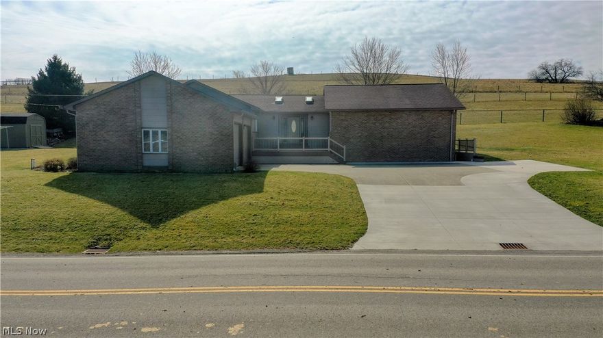 This large mostly brick ranch home sits on .769 acre and overlooks the Walnut Creek valley. The home has 3 bedrooms including the master suite, a Schrock’s Kitchen with a bar area, dining room, living room, family room and a total of 2.5 baths. The full basement has poured walls and is partially finished.  Other amenities include the 2-car garage, maintenance free front porch, back deck area and a storage barn.  This one owner home has been well cared for and is conveniently located just south of Walnut Creek.  The utilities for the home include gas heat, air condition, (2) water heaters and private well & septic.