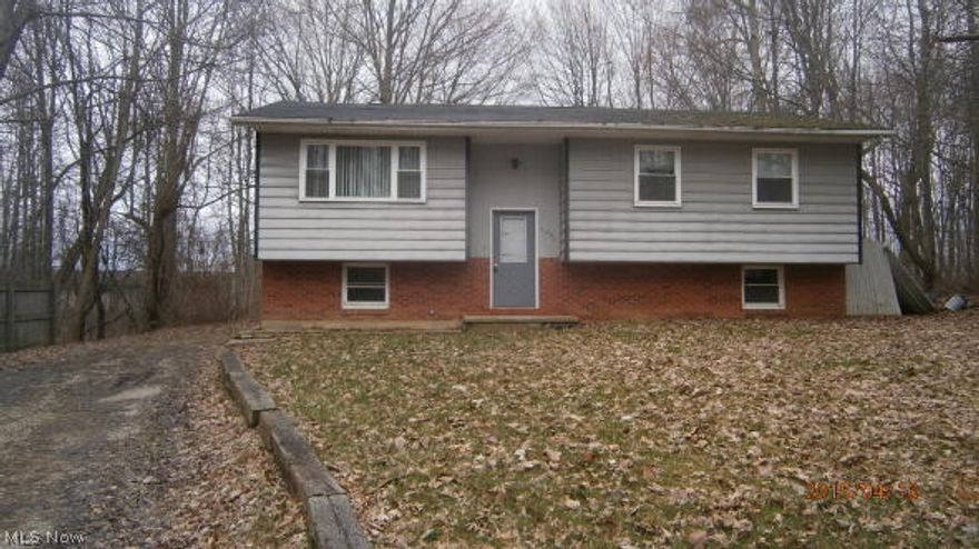 Spacious bi-level in need of tlc. Back deck/patio. Great investment property or starter home. Nice treed lot. Priced to sell