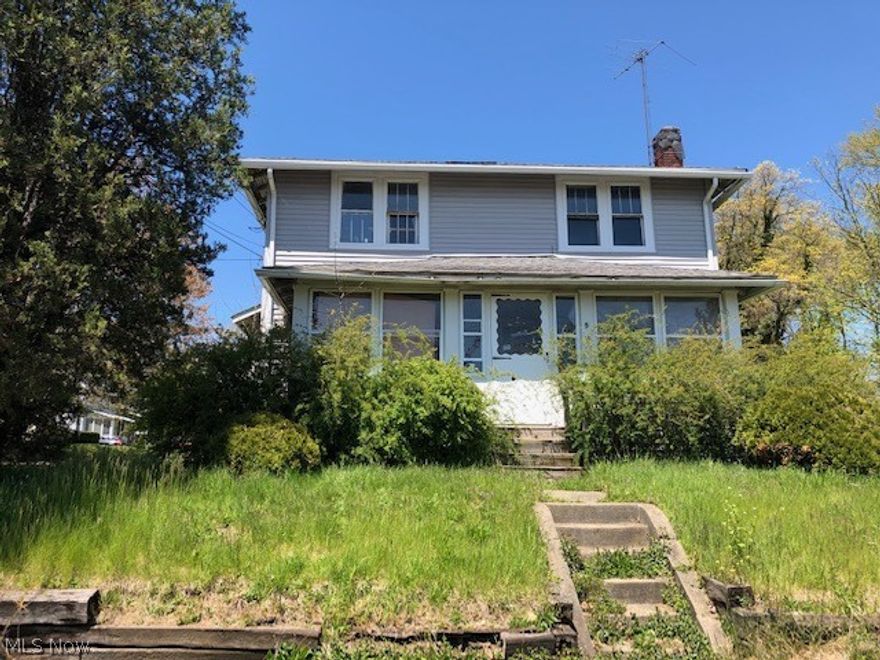 This home sits on a hill with a full enclosed porch on the front. The home needs work to bring it back but it has 1200 square feet, 2-full baths, 2-car garage to work with. If you are looking for a home to live in or for your portfolio, this is affordable.  This is being sold "AS-IS" Include proof of funds/loan approval letter, and a minimum of $1,000.00 earnest deposit. Please have your agent download and read the supplement and sign when you are presenting an offer.

There is a $75.00 technology fee associate with an accepted offer at closed. Please discuss all requirements and fees with you agent.