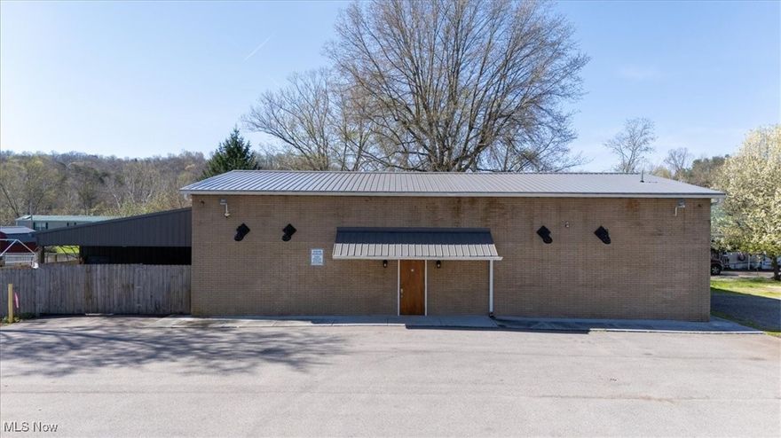 Commercial opportunity for this property that was formerly the bar called The Rendezvous Lounge. The building features block construction with steel truss/joists - New Metal roof in 2022 - Two New HVAC units in 2022 - Men's and Women's Restrooms -
Updated lighting - Updated Electrical - Newer Ceiling Fans - Full Bar - Camera Security system with motion sensors - Total of 6 Man door Exits - Multiple Buzzer switches to unlock front entrance door - Large asphalt parking lot - Multiple use property. Would make a Great man cave garage with the addition of an overhead garage door. For Sale OR Lease. Lease price is TBD.