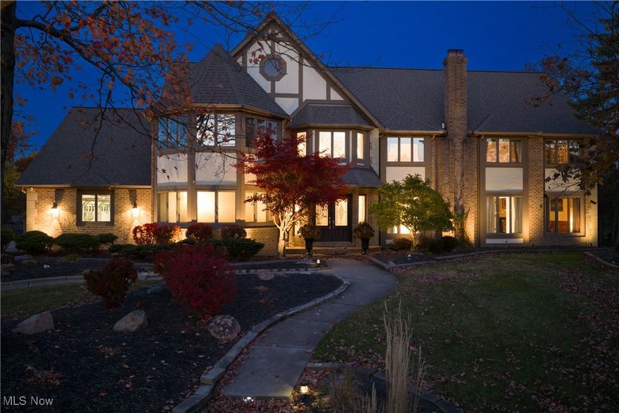 This stunning home offers 5 beds, 3 full and 2 1/2 baths, and exceptional amenities designed for comfort and style. Step into a breathtaking 2-story foyer with a dramatic staircase and elegant chandelier. The open floor plan is flooded with natural light, highlighted by vaulted ceilings, skylights, and a striking stone gas fireplace that anchors the expansive great room. The chef’s kitchen is perfect for entertaining, featuring granite countertops, custom cabinetry, double ovens, dual sinks, and an island with bar seating. A formal dining room and cozy family room offer additional gathering spaces. The 1st floor includes a bedroom suite with full bath—ideal for guests or multigenerational living—plus a dedicated office with French doors and large windows. Upstairs, the luxurious primary suite has its own fireplace, spacious sitting area, walk-in closets, dual vanities, and a soaking tub. A loft overlooking the great room provides space for play or work, and three additional bedrooms on the second floor share a full bath. The home also features a finished basement, built-in sauna, a large first-floor laundry room with storage and a sink, and a central vacuum system. The private backyard oasis includes a heated in-ground pool with slide, fire pit, gazebo, and professional landscape lighting. An attached, heated 4-car garage and lighted basketball hoop complete the exterior. Major updates include new central A/C, new fence, luxury tile flooring, fresh paint, and updated landscaping.