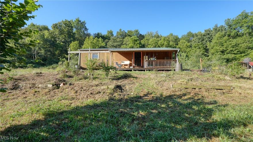 Discover your ideal off-grid retreat! This one-bedroom home sits on approximately 10 acres, featuring a balance of open space and wooded acreage. While the home does not currently have water or electric service, it is set up to run electric from a generator, and gas is already in place. Whether you’re looking for a hunting cabin, an off-grid lifestyle, or a temporary residence while you build your dream home, this property offers endless potential.