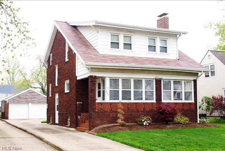 Stately brick 2-story, spacious enclosed front porch leads to oversize living room with fireplace, built-in cabinetry and beautiful woodwork.  Formal dining room features window seat with storage.  Efficient kitchen with wood cabinetry, all appliances stay.  Additional den, office areas on both first and second floors could be extra bedroom or flex space.  Two-car detached garage, shed, and lovely landscaped yard!  Call today before it's gone.