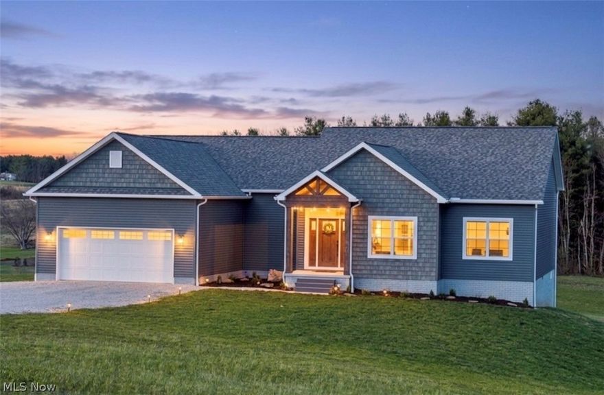 Why wait to build when you can move right into this beautifully crafted 2024 Schumacher-built home offering modern design, open-concept living, and peaceful acreage? Situated on 3.04 private acres on a quiet cul-de-sac in the highly desirable Warren Local School District, this thoughtfully designed one-level home features 3 bedrooms and 2 full baths with a seamless, functional layout. Built in 2024, the home combines the appeal of new construction with the benefit of being fully completed and move-in ready. The open great room flows effortlessly into the kitchen and dining area, creating a bright, welcoming space anchored by quality finishes and clean, contemporary style. The kitchen is designed for both beauty and function, showcasing quartz countertops, an oversized island, abundant cabinetry, and direct access to the main living area — perfect for gatherings large and small. The primary suite offers privacy and comfort, highlighted by a tray ceiling and a spacious en-suite bath featuring a walk-in shower, double sink vanity, and separate his-and-her walk-in closets complete with custom organization systems. The secondary full bath also includes a double sink vanity and a relaxing soaker tub. First-floor laundry adds everyday convenience, while a spacious two-car attached garage enhances functionality and storage. The full unfinished walkout basement, already plumbed for an additional bathroom, presents exceptional opportunity for future expansion — whether you envision a recreation space, guest suite, home office, or additional living area tailored to your needs. Opportunities like this — nearly new construction with acreage, modern finishes, and thoughtful upgrades in Warren Schools — are rare. Schedule your private showing and experience the space, quality, and potential this home offers.