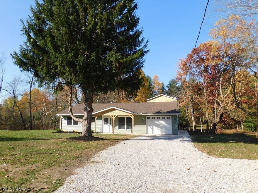 Shed the Hustle/Bustle of the big noisy city and step into your very own private paradise! This move in ready home set about 600 ft off the road and boasts a brand new beautiful open floor plan including a gorgeous new kitchen with new cupboards, counter, backsplash and all new stainless appliances add the large island for even more counter space! the living room/kitchen open concept will make entertaining  easy with plenty of room . Bring that Holiday feast into the spacious dining room that overlooks the parklike back yard and gorgeous pond, or have coffee and quiet in the enclosed back porch or open patio with a view to adore.  The brand new roomy bath has access from the main hallway and the master bedroom. The 1st floor Master Bedroom has a walk in closet! Bedroom 2 also on the 1st floor has great closet space too!.  need a 3rd bedroom or just a quiet computer or office space? just up the stairs this bedroom has good closet space and its own half bath. The attached garage adds eve