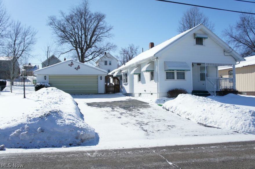 Move-in ready! Nice home with two lots and a fenced in yard. New roof in 2009. All new windows, fresh paint, new carpet (hardwood floor underneath), wood burning fireplace equipped with blower. Washer and dryer are negotiable, mini refrigerator in the basement is included. Over-sized 2 car garage with additional storage space in attic. Home has covered porches in both the front and back. Minutes away from shopping plazas and highways.