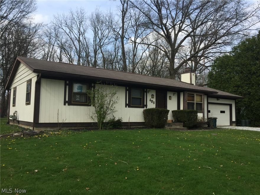 Great ranch in New Franklin on a wooded lot. Lovely living room with a fireplace, fully finished basement with a bedroom, office, full bath and storage. Maintenance free floor in basement. Spacious deck overlooks wooded lot and large storage shed. Near the schools, football field and more. Enjoy the nearby Portage Lakes State Park too. Call for a personal showing today.