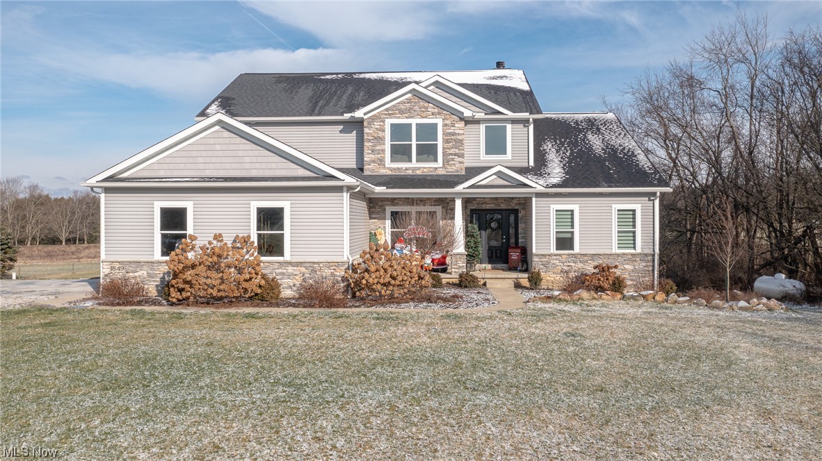Discover your new lifestyle in this fabulous Colonial with Highland Schools. Built by Decor Design of 2x6 walls with high efficiencies, quality and luxury in 4500+sq.ft. of living space. Smart technology integrated for lighting and comfort. This 3 bedroom, 2.5 bath home has been meticulously maintained with professional landscaping on over 7 acres. The front porch is a great place to sit or relax on the tiered Trex deck. The 2 story entry foyer leads you to the Great Room with a wall of windows overlooking the rear yard and a floor to ceiling stone wood-burning fireplace. A gourmet kitchen that is a cooks dream with quartz counters, high-end SS appliances, island, gas cooktop with range hood, microwave and wall ovens, coffee nook, walk-in pantry and cabinetry galore. Reverse osmosis water line to the fridge for purified water. The dining room has a cathedral ceiling with lots of windows and a patio door to the rear deck. A den or office which is also off the foyer. Generous 2-1/2 car garage with opener, water, drain and 220V outlet. The handy mudroom with built-in cubbies for quick and easy coat/shoe storage along with another coat closet plus the convenience of the first floor laundry room. The first floor ensuite master bedroom has cathedral ceiling, double vanities, walk-in tile shower and a huge walk-in closet. An open staircase leads you up to the loft and a balcony between the bedrooms with walk-in closets. A double sink vanity in the full bath upstairs and large linen closet. A fabulous walk-out lower level features an expansive rec room that just needs some finishing touches, has a stubbed out bathroom, insulated and drywalled walls, flat black ceiling, recess fixtures and tons of storage. Patio doors bring you to the back acreage with woods, a creek, pasture land that is ready for your next project. Secluded and spacious but only minutes away from shopping, dining and I-76. Make this your next dream home - contact your favorite REALTOR to see it today!