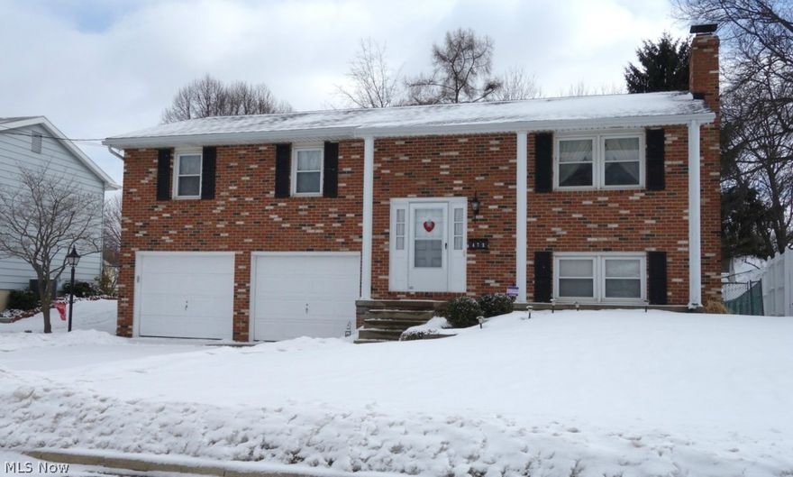 Fantastic location in the heart of North Canton. What a wonderful place to call your new home. The eat-in kitchen has been updated with pretty maple cabinets, hard surface counter top and comes fully applianced. The master bedroom has a full, private master bath. An updated full bath is shared by the other two bedrooms. Great recreation room adds more space to spread out and is graced with a very nice fireplace and half bath. Oversized two car garage for extra storage. Hang out on the second floor deck off the dining room and enjoy a large, fenced-in backyard!  Beautiful brick front with newer shutters and updated shingles. The furnace, air conditioning and glass block windows have been updated as well.