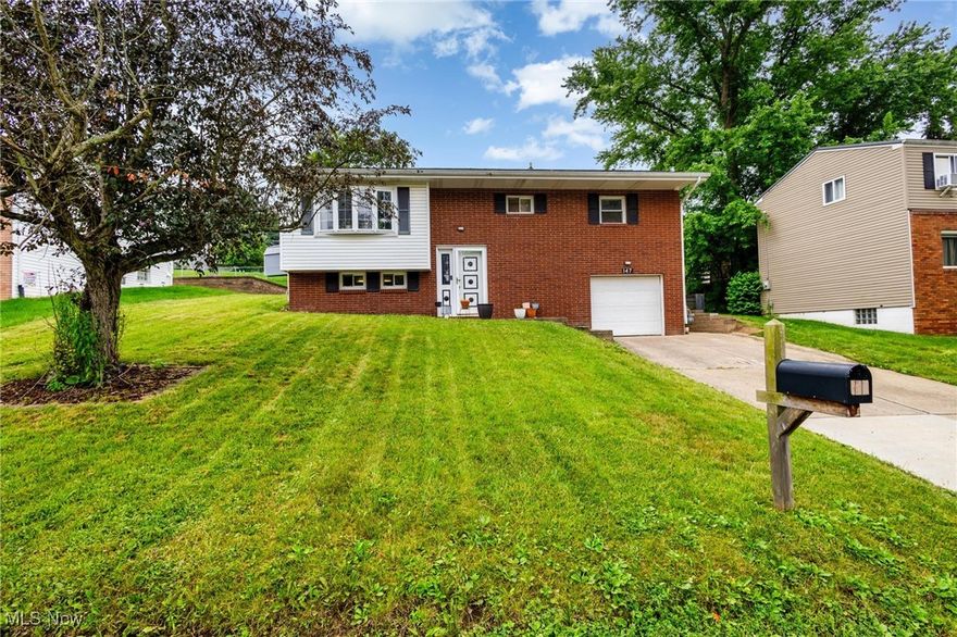 Don't pass up this charming turn-key house in the heart of Wintersville! The entire home has been lovingly maintained with many new updates just this year. The main floor features the bedrooms, bathroom, living room, kitchen, dining area, and family room. The door in the family room takes you right outside onto the covered patio in the backyard. The finished basement includes another living area as well as a bar, laundry room, full bath, and attached garage. This home comes with many updates including a furnace (2025), AC (2025), hot water tank (2025), updates to the kitchen and bathrooms, and a new landscaping retaining wall. Nothing left for a new owner to do but move in!