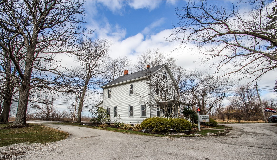 Fabulous commercial property on over an acre of land with many possibilities. Includes an 1871 SF house that has 4 BR's and 2 full baths.