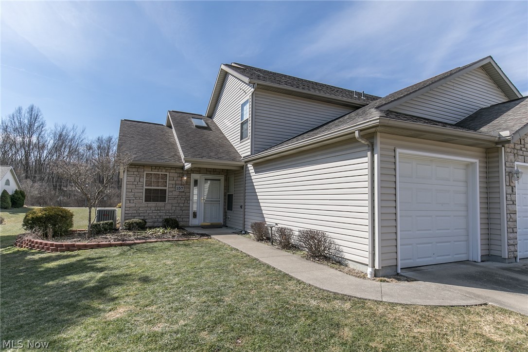 An exceptional 3 bedroom, 2 full bath Munroe Falls condo in the desirable Falls River Crossing. This unit has an attached 2 car garage, first floor laundry, first floor bedroom, first floor full bath, private patio, and so much more. The large Great Room has cathedral ceilings. The upstairs consists of two large bedrooms, and a jack & jill bath. The master bedroom has a huge walk in closet. An open kitchen has an eating area. The unit is all electric.