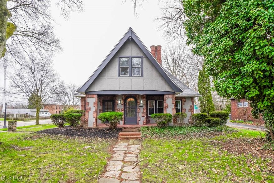 This beautifully remodeled Tudor Revival has so much to offer! With updates like a new roof, windows, A/C, and electric, you’ll love how fresh and modern it feels. The kitchen is a standout, with butcher block countertops, new cabinetry, and a cozy breakfast nook that’s perfect for enjoying your morning coffee. The dining room is filled with natural light and hardwood floors, flowing into the living room where a charming fireplace with tile surround adds a welcoming touch. A sunroom with separate entry from the covered front porch is the perfect spot to unwind with a good book. Two main-floor bedrooms, including the primary suite with a walk-in closet, share a refreshed full bath. Upstairs, you’ll find two more bedrooms, a versatile bonus room and another updated full bath. The corner lot provides a nice sized yard and a two car side load garage. Located in historic West Akron, close to Schneider Park and all the great spots in Highland Square, this century home is one you'll want to see.  Schedule your tour today!