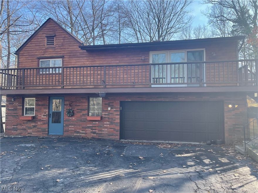 Welcome Home to this beautiful wooded 3 bed, 2 full bath home located in highly desirable North Royalton!  Be amazed as you pull up the driveway by the picturesque wooded lot!  Walk into the home and be amazed by the updated kitchen with an abundance of cherry cabinets, tile backsplash, updated lighting, large farmhouse sink and a pantry!  The large living room with a brick fireplace will lead you to the oversized deck looking out into the backyard of woods!  The master bedroom has a large walk-in closet, a full updated master bath and a private sliding door for you own sitting area!  The 2nd full bath has been updated with granite counter tops, ceramic tile, Moen faucets, and Kichler/Progress lighting. Roof is less than 2 years old!  Privacy is an understatement on this nearly 2 acre lot!  2 sheds and a greenhouse are an added bonus!  Don't miss this one!