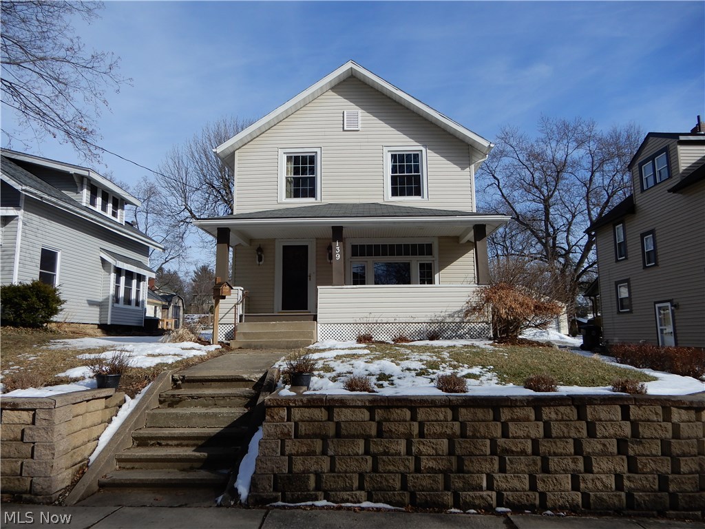 Charming Old World Colonial Home with original rich woodwork and trim with modern updates. This home features a covered full-length front porch that welcomes one to the front door that enters a light-filled, comfortable living room that leads into a formal dining room with hardwood floors and a set of doors that go out to the deck and backyard with a 2-car, detached garage (built 2005). The kitchen updates include cabinets, flooring, lighting fixtures and appliances. The upstairs features 3 bedrooms with the master bedroom having a walk-in closet. The remodeled bathroom features a double vanity sink, updated fixtures, and newer plumbing. This home is located on a mature tree lined street close, to schools, churches, parks, downtown Wadsworth and the Blue Tip parade route.