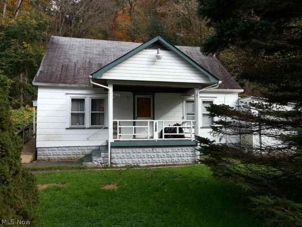 Cozy 3 BR home perfect for first time home buyers or someone looking to downsize. Main level has living room, eat-in kitchen, full bath, and 2 bedrooms. Upstairs could be used as a 3rd bedroom or for extra storage space. Call office for info on septic.