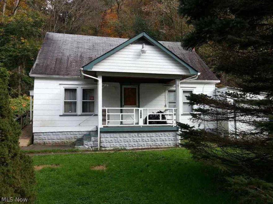Cozy 3 BR home perfect for first time home buyers or someone looking to downsize. Main level has living room, eat-in kitchen, full bath, and 2 bedrooms. Upstairs could be used as a 3rd bedroom or for extra storage space. Call office for info on septic.