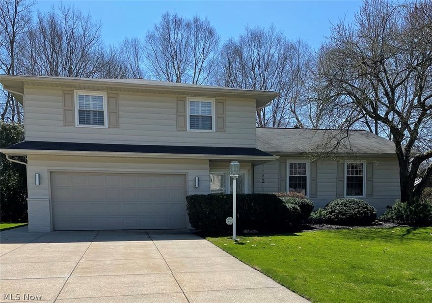 Looking for a home that has been maintained to the Nth degree with a backyard second to none?  This 4 bedroom, 2 1/2 bath split level in Lyndhurst's Meadowood Estates is it!  Pretty foyer leads to vaulted, beamed living room and dining room.  Kitchen with room for seating 6 overlooks family room with built-in.  Sliding glass doors lead to 19 x 13 screened porch that opens to magnificent enclosed backyard with deck, patio, and gardens---a site where many wonderful occasions occurred and memories made.  Upstairs are 4 bedrooms, the primary bedroom has 2 closets and an ensuite bath, and another bath for the other bedrooms.  There is a finished recreation room in the basement, a 2 car attached garage complete with a special plug for an electric vehicle.  The home is in a great location with easy access to highway, downtown Cleveland, University Circle, dining, shopping and recreational park.  Family room corner cabinet is included with the house---it was built for the space but can be easi