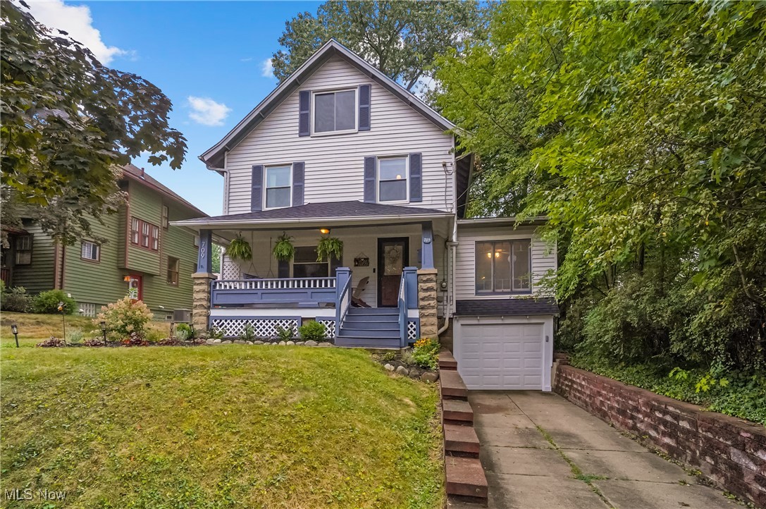 Welcome to this charming century home nestled on a picturesque brick street in the highly desirable Highland Square neighborhood. Character and charm are showcased throughout this home including curved archways, hardwood floors, wood doors with vintage glass knobs, classic crown molding, wide baseboards, and custom built-ins that reflect the craftsmanship of that era.
Enter into the spacious living room, where natural light is abundant with large windows and crown molding in the adjacent sunroom/office. The formal dining room is perfect for entertaining, featuring stunning built-in cabinetry. The updated kitchen offers granite counters, and a convenient powder room completes the first floor. Upstairs, you’ll find three comfortable bedrooms and a full bath, while the third floor offers a private fourth bedroom featuring a walk-in closet. Updates include: New Roof - August, 2025; Furnace and hot water tank - 2023; AC - 2018. An attached one-car garage adds everyday practicality to this unique and character-rich home. Close to the Cuyahoga Valley National Park, restaurants, and library don’t miss your chance to own a piece of Highland Square’s history on one of its most charming streets!