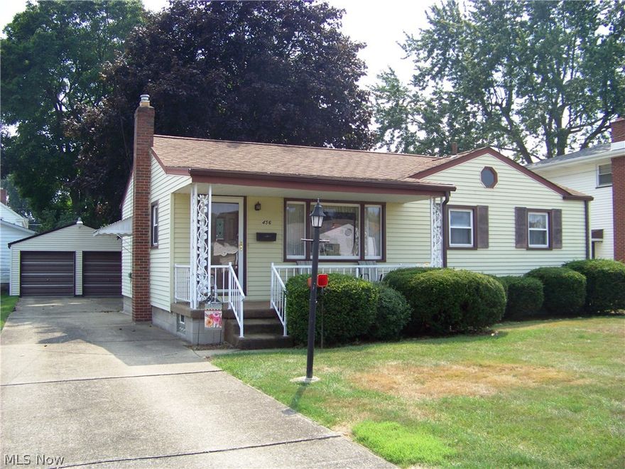 Welcome to this charming well maintained 3 bedroom vinyl sided ranch home. Your covered front porch will greet you as you arrive or will be a a great place to meet your guests and neighbors. Once inside the main floor offers a large living room, eat-in kitchen with newer stove and refrigerator, 3 bedrooms and a full bath. There are hardwood floors under the carpet in all rooms except the kitchen. Almost doubling your living space is the rec room in the basement. It offers plenty of room for the eating/gaming area, entertainment area, and a built-in 4-5 stool dry bar. The basement also has a workshop room, storage room, and a laundry room with a newer washer & dryer, a second range, and a full bath. Updates include: waterproofed basement, replacement windows, 2 steel entry and storm doors, electric service, dimensional shingled roof, gutter guard and appliances. Outside is the 2 car garage with 220 electric and a fenced in rear yard. One year home warranty is included. Ask agent for det