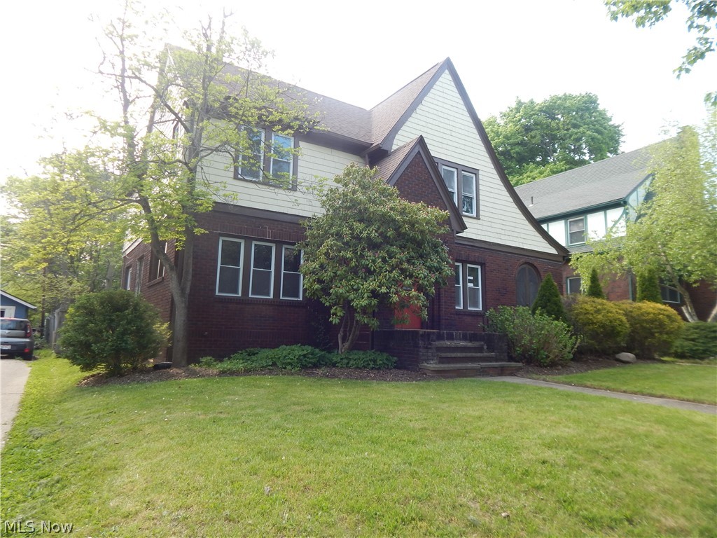 Welcome to this darling Tudor home in West Akron that is filled with charm! Step up the home and take a look at the enchanting front door. A large living room with a beautiful fireplace, lots of natural light and an arch doorway that opens into the dining room. The dining room has a large front window and will make the perfect spot for entertaining as it opens to the updated kitchen. The kitchen boosts white cupboards, subway tile and the perfect spot  at the counter to pull up a stool and enjoy a cup of coffee into the kitchen. The den is off the living  and includes built-ins and lovely French glass doors to open up to a patio. Four nicely sized bedrooms. Stunning hardwood floors throughout to add to the charm! Do not miss out on this beautiful West Akron Tudor!