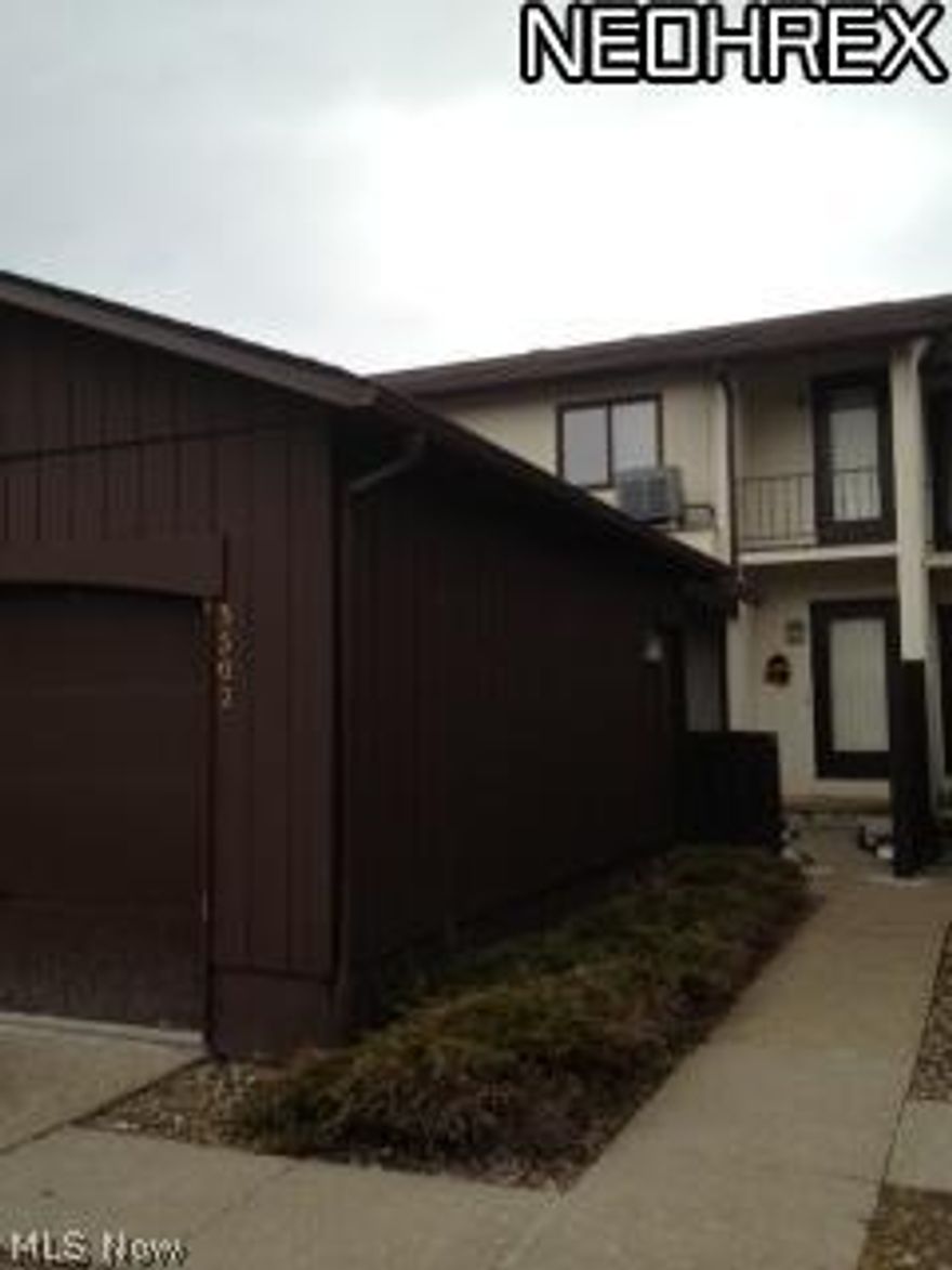 Contemporary townhome in the Mesa Grande Subdivision offers a fully appointed kitchen where all the appliances stay and a patio door is conveniently located to lead to the front courtyard area between the home and garage. The open floor plan includes a formal dining room with wet bar that's open to a step down living room  where you can cozy up to the lovely brick, corner fireplace...wood burning fireplace that is. The patio doors exit to the secluded, fully fenced rear deck where a private green space and trees are there for your enjoyment. Both the master and 2nd bedrooms are a nice size. The full basement includes a storage area with laundry room and finished rec room/bedroom or office. Lot's of storage. Make your appointment today to see this beauty!