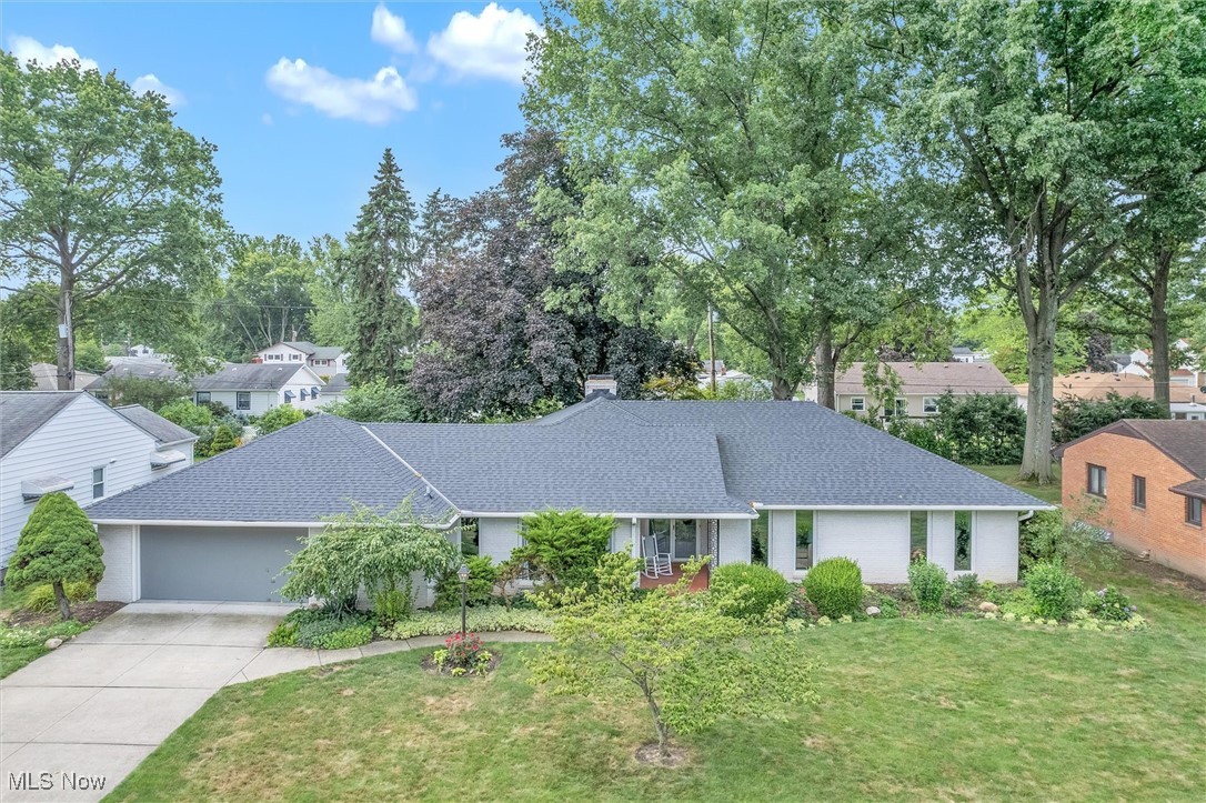 This custom-built white brick ranch sits on one of Elyria’s most desirable streets. Spanning over 2,300 square feet, this 3-bedroom, 2.5-bath midcentury modern gem features floor-to-ceiling windows that fill the interior with natural light and luxury vinyl plank flooring throughout.
Recent updates include a new electrical panel (2024), roof (2020), and furnace and A/C (2018). Inside, you’ll find a formal dining room, first-floor laundry, and a spacious kitchen with built-in double ovens plus both gas and electric cooking options. The vaulted living room features a wood-burning fireplace insert and opens to a bright sunroom overlooking the private backyard oasis.
Step outside to a fenced backyard retreat complete with an above-ground pool, hot tub, concrete patio, grilling pavilion, and river rock landscaping.
With all the big-ticket updates already done, don’t miss your chance to own a true architectural standout in Eastern Heights!