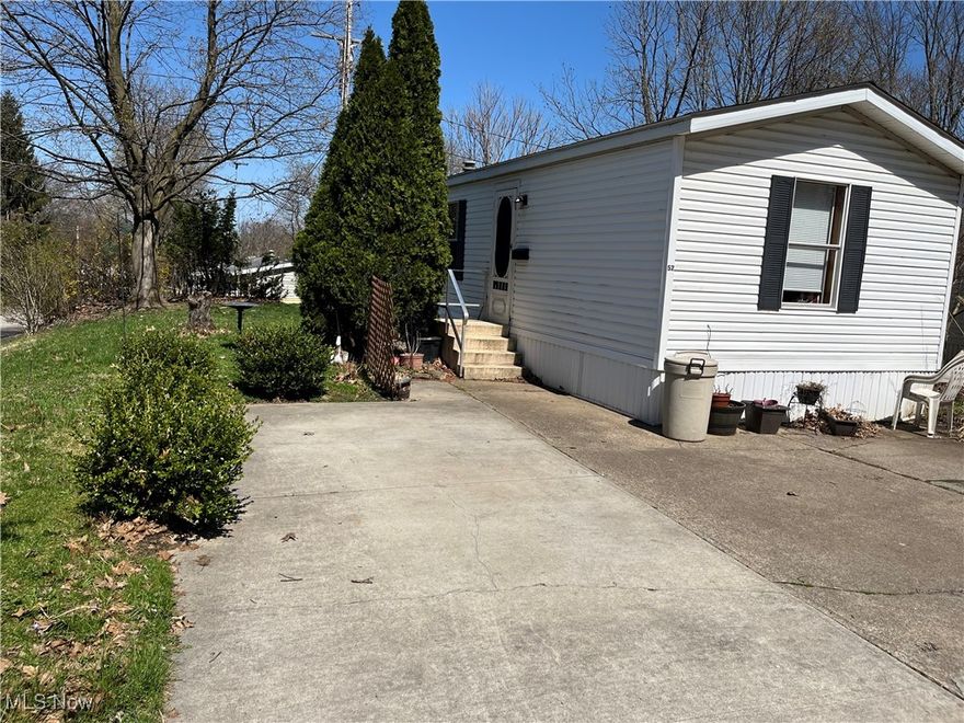 Affordable Lorain! This 2 bedroom mobile home in Twin Wells has new flooring in the living room and hallway. The roof is one year old and the hot water tank is newer as well. This home is in a quiet location on a dead end street that faces the woods. Lot rent is one of the lowest in the county, you can own your home for cheaper than renting an apartment! Showings are available for cash buyers with proof of funds or a pre-approval letter for a mobile home friendly loan. Sold as-is.