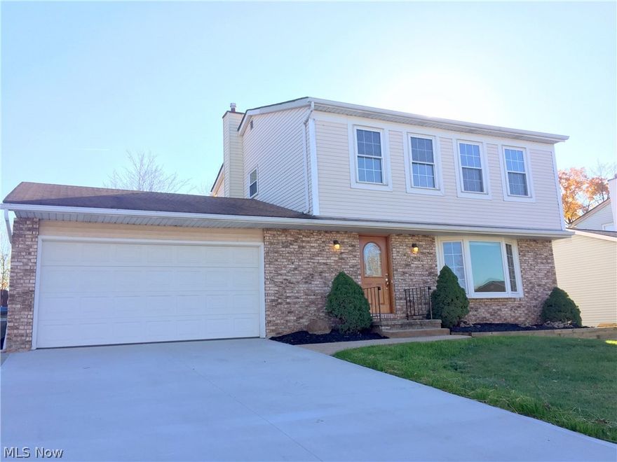 Absolutely in move in condition three bedroom colonial. Recent updates include new driveway,  new rear stamped patio, new front landscaping new interior paint, new carpeting, and new laminate flooring.  A gorgeous kitchen which includes stainless steel Samsung microwave, oven, and dishwasher. It overlooks a beautiful family room with vaulted ceiling, dual double pane sliding glass doors and fireplace. Two sliding doors lead out to the stamped patio and fenced rear yard. A living room with neutral décor, bay double pane glass window and a half bath with new toilet, new vanity complete the first floor. Upstairs you will find the very spacious master bedroom, two additional bedrooms and a full bath with double sinks. Additional living space in the finished basement, which also includes an updated electric panel, glass block windows, and a shower stall.  Two car attached garage with rear access to backyard along with an extra wide concrete pad for additional parking. This home is truly in