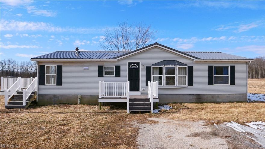 The updated "Country Living" Ranch home you've been looking for! New Metal roof and two porches installed in 2024. Three bedrooms, two full bathrooms- beautifully updated. When you enter in the front door you're greeted by a beautiful wood fireplace and an open floor plan. The spacious Livingroom with large windows leads into the kitchen and dinning room, which overlooks the most beautiful sunsets. Off the dinning room is a full laundry room. In the kitchen you'll find "Hand Crafted Live Edge" countertops on fresh new white cabinets. New Stainless steel appliances and plenty of space for additional cabinetry or an additional island if desired. In the private master suite you'll find a large utility closet that could be transformed into a walk in closet. Master bathroom is through the bedroom and very spacious. The second full bathroom and two bedrooms are on the other side of the living room. The property sits on almost three acres and has additional 4.9 acres avalible! Don't wait, schedule a private showing today!