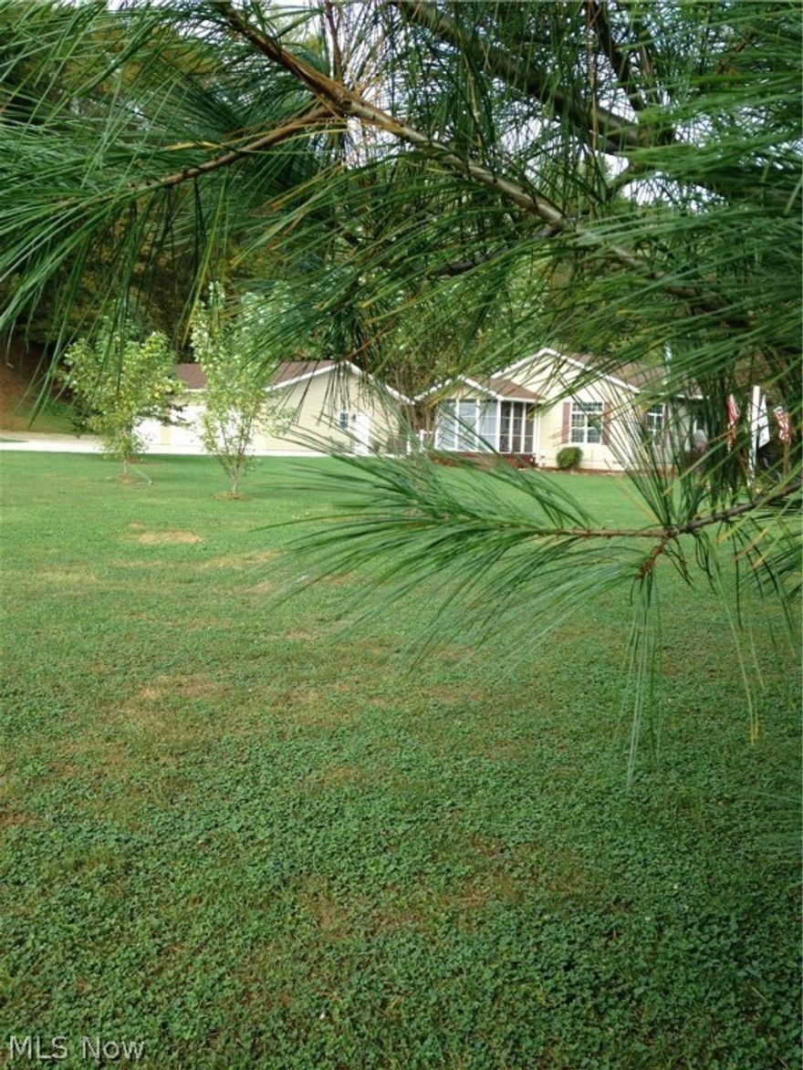 Don't miss this amazing property just 1/2 mile off of SR 16! 4 bedrooms, 2 full baths, screened in porch, deck, wood-burning fireplace insert, huge 32 x 40 3 car garage with many extras including water, floor drains, ceiling fans, a bar and tons of storage. An additional 28 x 32 pole building with electric and 2 sliding doors, one being an extra tall 12' door for easy equipment storage and a like new 10 x 20 storage building with loft & electric. All this on a level 1.2 acre lot. The house is equipped with an outside generator hook-up. Additional 2.7 acres available MLS#3947233 . Call today for the extensive list of additional features that make this a must see home.