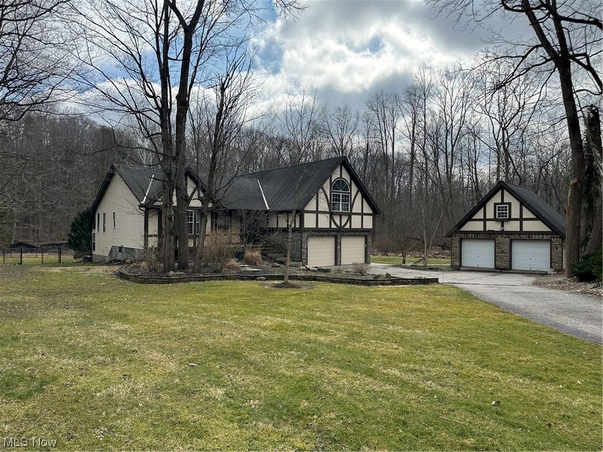 It does not get any more peaceful and tranquil than this beautiful property!  Your own river runs right through the back yard, it's a truly unique setting.  This home has been completely renovated and is ready to move in!  New flooring, granite counter tops, bathrooms, all new fixtures, new garage doors.  Home also has a backup wood/pellet furnace installed. Large bonus room that would be perfect for a home gym or hot tub room (vent has been installed).  There is an open loft that would be great for a home office/playroom.  Fully fenced in back yard, and a full loft above the detached two car garage that can be finished for additional living space.  Come take a look and fall in Love!!