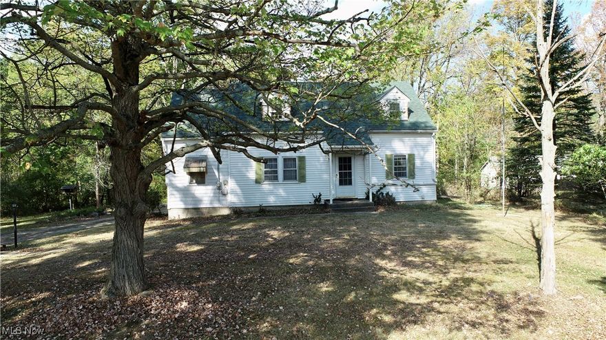 Welcome to 3949 Remsen Road, a peaceful retreat nestled just 10 minutes from Medina Square in beautiful Medina County. This charming 3-bedroom, 1-bathroom home sits on nearly 3.5 acres of lush land, offering plenty of space and potential for your dream property. As you arrive, you'll notice a lovely setting all around that will bring peace to your heart. Step inside to a spacious living area featuring built-in bookshelves and a cozy fireplace, perfect for relaxing evenings. The welcoming hallway leads to a charming kitchen equipped with a classic wood-burning stove, while the large dining room, surrounded by windows, fills with natural light—ideal for family meals and gatherings. Beautiful woodwork throughout the home adds warmth and character, including an all-wood staircase that ascends to two additional bedrooms and a generous storage space upstairs. The property’s garage sits just in front of a tranquil stream, framed by mature walnut trees, creating a picturesque setting. Beyond the home, explore the neighboring parcel of land, which includes a serene pond and a buildable lot ready for your vision. Backs up to hole #8 on Pleasant Valley Country Club—offering unbeatable privacy and proximity to local amenities, shops, and restaurants. See also MLS#5162270