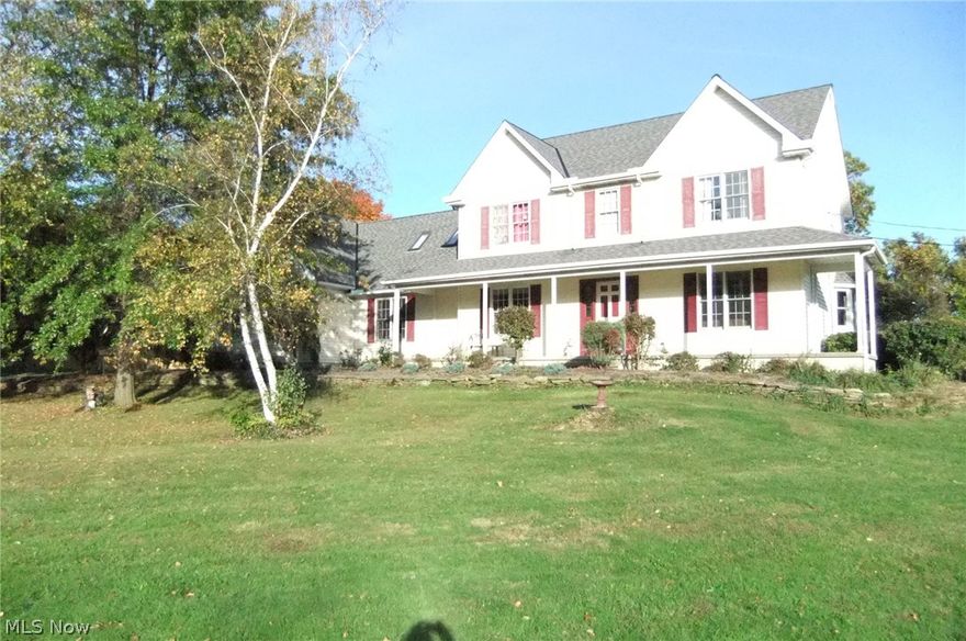 1-owner custom built home on hillside setting with almost 3 acres of land (2.84 Acs) with 300 ft frontage. Both parcels are included in price. For the Hobbyist, there are a total of 8 garages - 7 overhead doors. 34x32 4 bay pole barn w/110V & 220V electric service. 3 bays are heated. 5th bedroom home with the 5th bedroom presently being used as an office. Great room features a raised hearth brick fireplace with gas and an Atrium door leading to 3 tier deck overlooking a park-like setting. Over-sized kitchen has a full wall breakfast bar and center island with gas range, porcelain sinks and dishwasher.  There is a separate double built-in wall oven and refrigerator which stay. Formal dining area off kitchen could be carpeted. Sunken living room is off foyer area. There are 2 separate staircases leading to the 2nd floor. One goes directly to master bedroom suite which features 10x8 walk-in closet and the bathroom with an over-sized whirlpool tub and separate shower. There are 2 laundry r