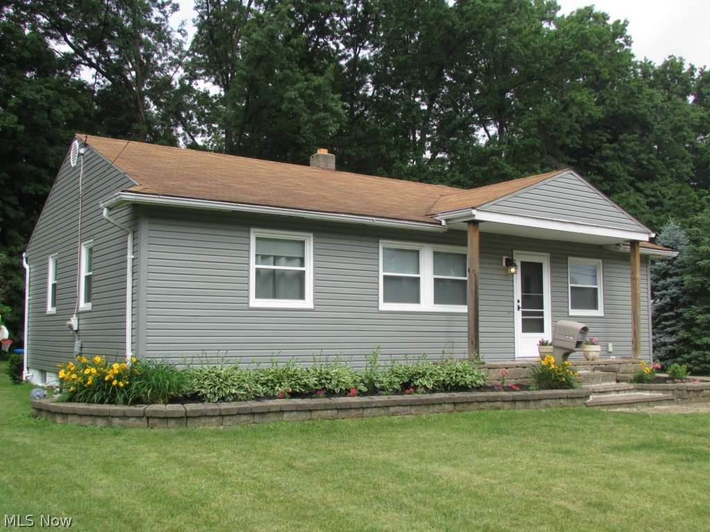 Welcome home to this wonderful ranch with 2 car garage, deck and covered patio. Main floor has 3 bedrooms with hardwood floors, large living room, dining room and kitchen with laminate floors. The lower level has approximately 120sf fully finished, and 325 sf that is partially finished. A few finishing touches and it will give you about 1400sf of living space when fully completed. Windows replaced in 2013, disposal 2014, sump hot water tank in 2010. This home has many updates including front porch, landscaping, new garage doors, deck, updated bathroom with stone, and tiled shower. A great value at this price!