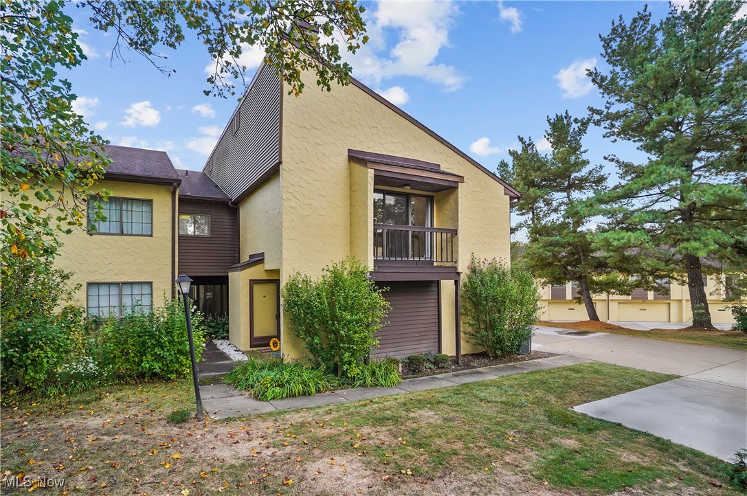 Wonderful townhouse/carriage house Condo in desirable Hampton Woods. Enter the foyer from the street or the attached 2-car garage. Once upstairs you basically have ranch living with large, carpeted living room/dining room combination with gas fireplace, pendant lighting and sliders to balcony/deck. The gorgeous updated kitchen has maple cupboards, granite countertops, stainless steel appliances, ceramic tile floor with eating area at the end by the window for natural light and view. At the end of the hall is the large, carpeted primary bedroom with a hall of closets leading to the ensuite primary bathroom which has step-in shower, granite counter vanity, ceramic tile floor and linen closet. The second bedroom is also carpeted with ceiling fan and double closet, and is across the hall from the main bathroom which has tub/shower combo and corian sink vanity. Also on the main floor is the laundry room with washer and gas dryer that stay, utility sink, built-in cupboards, storage closet, vinyl floor and even room at the end for a little desk/office area at the window. The attached 2-car garage has a water spigot and drain. Around the corner from the front door is a bonus storage closet in case all the storage inside the unit is not enough! The association has a clubhouse, tennis/pickleball courts plus an in-ground pool. The association fee includes internet/cable and trash. Home warranty is also included. Make your appointment to see it today and start packing. (Eating area table with two leaves and chairs can stay or go.)