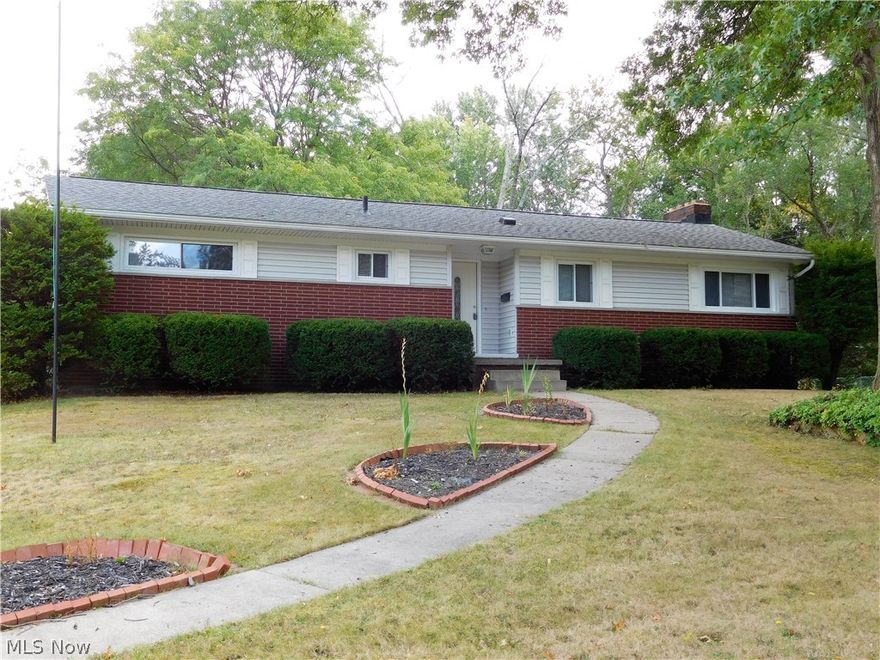 Fabulous updated MOVE-IN ready brick ranch on quiet street with completely fenced in backyard!  Newer exterior front door greets  you and opens into foyer area with newer vinyl slate style flooring.  Spacious kitchen with TONS Of oak cabinets and built in's.  All stainless steel appliances that STAY with the property!  Large eat in dining area perfect for seating six comfortably.  Living room is HUGE and features hardwood flooring and fresh paint.  Master bedroom has it's own newly remodeled bath (2016) complete with tile shower, flooring, vanity, and lighting.  Two other good sized bedrooms and another full updated bathroom complete the first floor.  Basement has recreational room w/wood burning fireplace, laundry/storage area and another updated 1/2 bath.  Two car attached garage.  Plenty of parking space, a fire pit and concrete patio--perfect yard for entertaining! Updates include roof, gutters and downspouts (2012); newer windows in living and dining rooms (2017), fresh paint thro