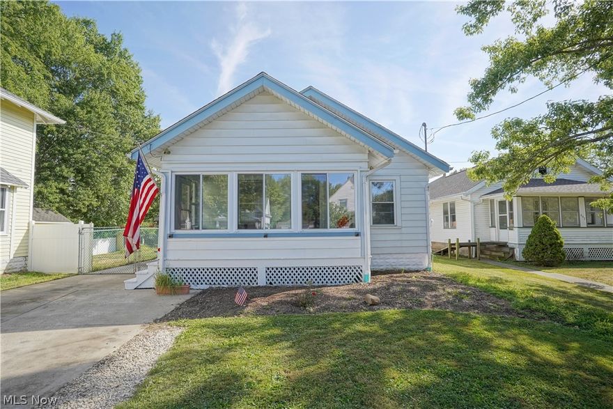 Check out this cozy home located in the heart of Ravenna. You are greeted by the sunroom that leads to the main living space with fresh brand new carpet. There is a formal dining room space off the living room which leads into an eat in kitchen with stainless steel appliances. Two bedrooms and full bathroom are located on the main floor. Downstairs, feature naturestone flooring with plenty of room for storage. Laundry room and bonus room which at one point was used as a music room. Large backyard with plenty of space. You will not want to miss this home. Features: new carpet in living and dining room, fresh paint in main living space, AC/Furnace new March 2020,  Water Tank 2016, Fridge and Range in 2018.