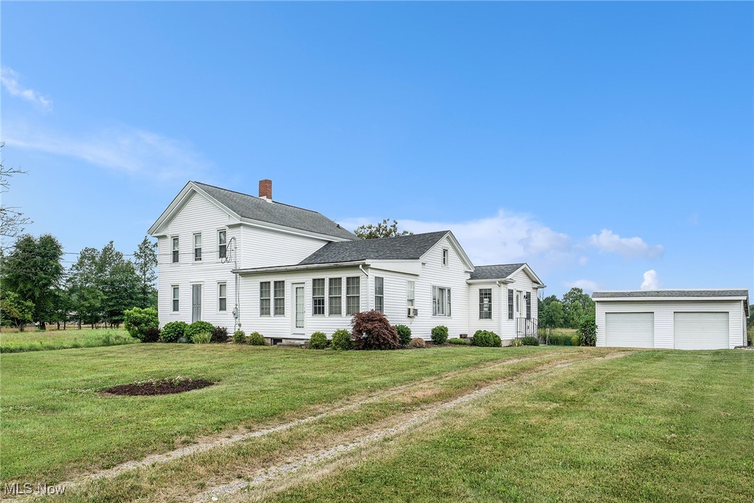 Nestled amidst peaceful farmland, this enchanting colonial home offers the perfect blend of timeless charm and modern comfort. This home has been in the family for generations and has been thoughtfully updated throughout. It sits gracefully on nearly one acre, providing a serene country setting without the upkeep of extensive acreage-and without any neighbors crowding your space. Step inside through the added entryway/mudroom, and you'll immediately feel welcomed. The expansive, gourmet kitchen. Remodeled and extended off the back of the home, it is a chef's dream, perfect for entertaining or preparing family meals. Walk straight into your formal dining room that showcases beautifully preserved original hardwood floors, creating an inviting space. This spacious home offers two separate living areas: a cozy sitting room just off the dining room, ideal for quiet evenings or intimate conversation, and an impressive extended living room at the front of the house, featuring a striking electric fireplace that enhances its warm, inviting atmosphere. On the main floor, you'll find 2 comfortable bedrooms complete with a generous walk-in closet for the main bedroom and a full bath. Upstairs, 2 additional bedrooms, a half bath and ample flex space allowing endless possibilities. Outside, the property includes a detached 2 car garage and a charming granary building that offers additional storage. The horseshoe driveway provides extra space for visitors to park. Surrounded by sweeping farmland views, this home provides a rare opportunity to enjoy tranquil, private country living. A true retreat where classic characters meet modern updates.