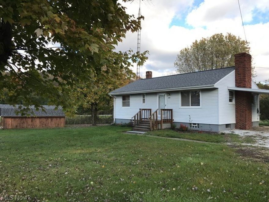 Cozy 3 bedroom vinyl sided ranch, minutes from town.  Eat in kitchen includes the range and refrigerator. Remodeled full bath, paint and carpet. Hardwood floors under the carpet throughout the main level.  Full unfinished basement features a brick fireplace and could easily add more living space.  New asphalt roof in 2014. 10 X 20 & 8 X 10 storage barns. 1 car attached carport. 0.8 acre flat lot. Midvale water service for the home. Private well for outside spigot only. Rented 50 gallon hot water heater $18.00+/- monthly. Seller is offering a home warranty through APHW.  Agent owned