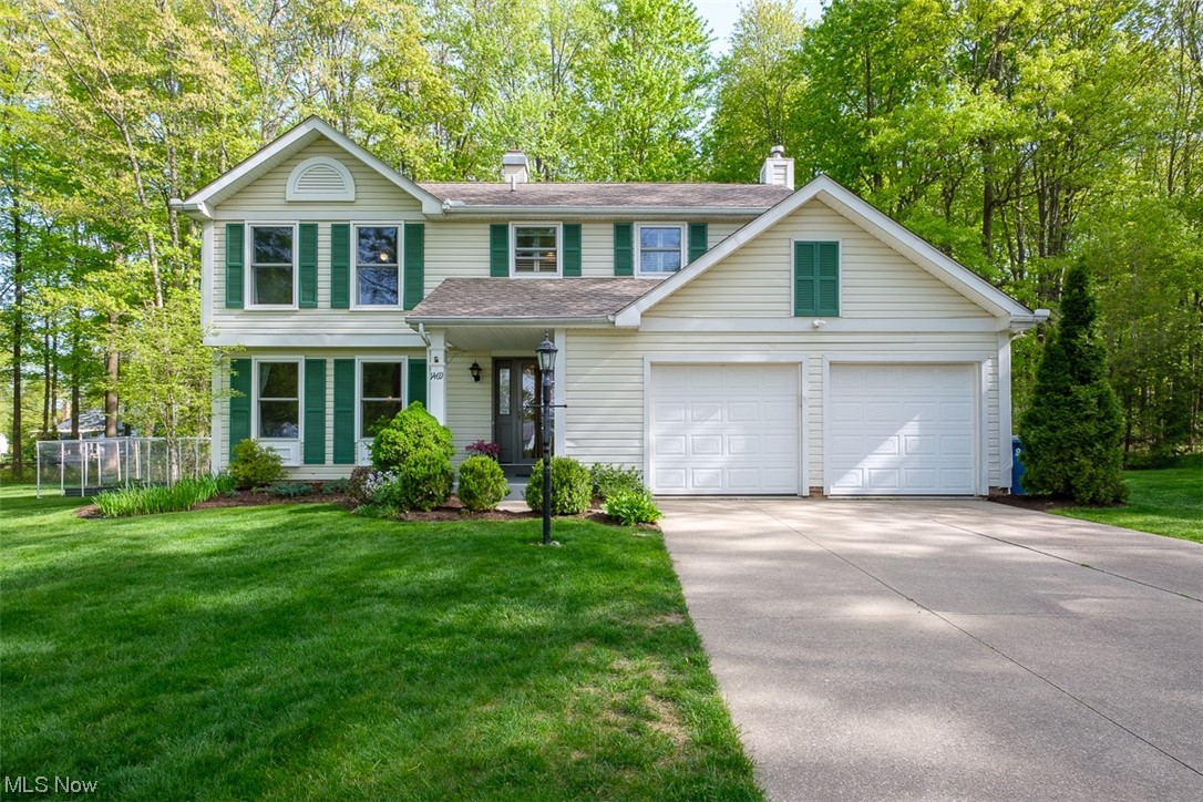 Welcome to this light and airy updated colonial featuring 4 bedrooms and 2 and 1/2 baths. The front entry greets you immediately and directs you to the front family room or a direct path to the updated eat in kitchen. Off the eat in kitchen you have a formal dining room and kitchen opens up to a wonderful open living room featuring a fireplace. Off the living room you will find a gorgeous 3 season room that opens up to the back deck and the wonderful wooded back yard. Upstairs you will find 4 bedrooms and 2 full baths. The spacious owners suite has room for a home office or just space to lounge as well as a walk in closet and private bathroom. Down the hall you will find another full bath and 3 other bedrooms. The lower level features a very spacious bonus room and laundry area. Some of the updates include Granite Kitchen countertops with new tile back splash in 2022, New tankless water heater in 2022, new luxury vinyl flooring in dining room and family room in 2022, new basement car